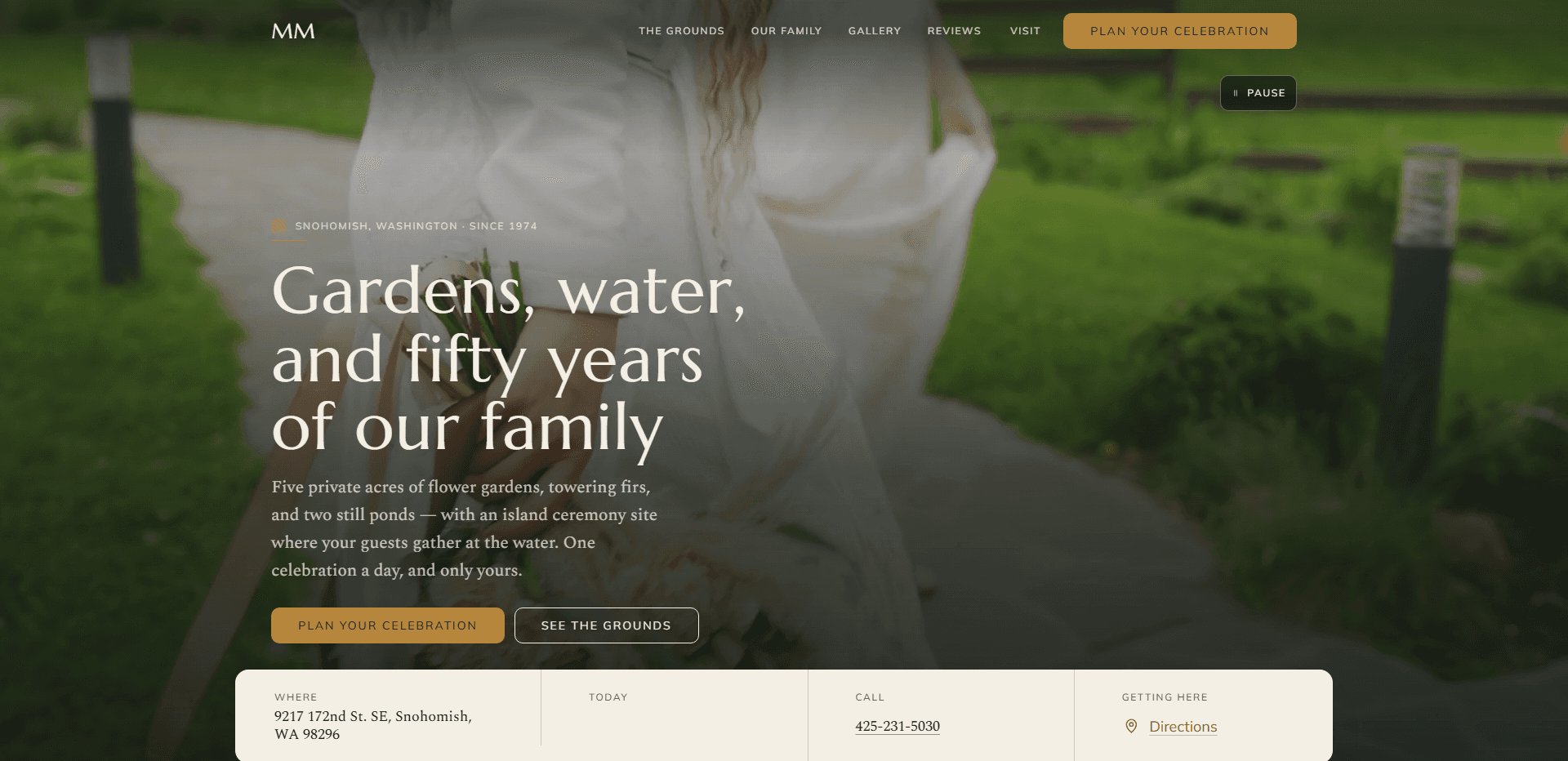 Homepage of Maroni Meadows: a soft-focus video still of a bride in a white dress holding a bouquet and lifting her skirt as she walks a stone path across a green lawn lined with post lights, under a top bar carrying an 'MM' monogram, navigation reading The Grounds, Our Family, Gallery, Reviews, and Visit, a gold 'Plan your celebration' button, and a pause control for the background video beneath it, above the kicker 'Snohomish, Washington - Since 1974', the large serif headline 'Gardens, water, and fifty years of our family', a paragraph about five private acres of flower gardens, towering firs, and two still ponds with an island ceremony site, and one celebration a day, a gold 'Plan your celebration' button beside an outlined 'See the grounds' button, and a cream information bar across the bottom listing where, today, call, and getting here, with the Snohomish address, the phone number, and a directions link.