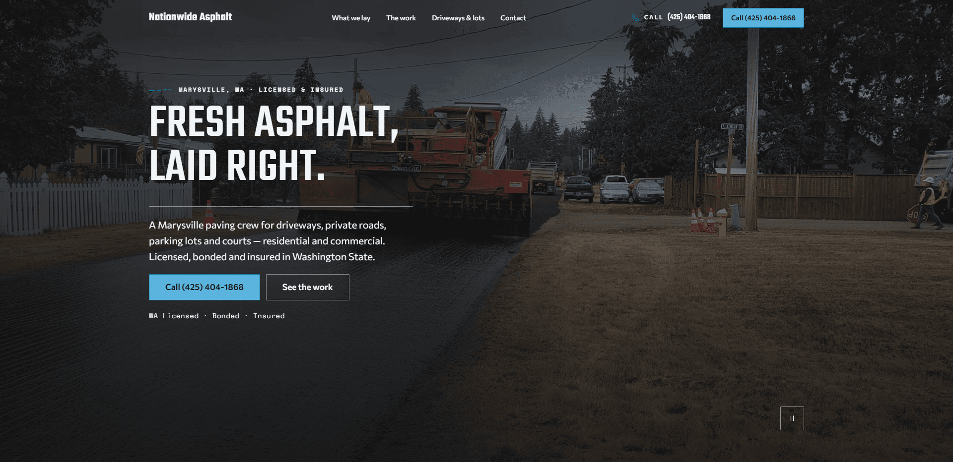 Homepage of Nationwide Asphalt: a dark grey wash over a video still of an asphalt paving machine laying a fresh black surface on a residential street lined with trees, parked cars, and orange traffic cones, under a top bar carrying the bold 'Nationwide Asphalt' wordmark, navigation reading What we lay, The work, Driveways & lots, and Contact, a monospace 'Call' phone number, and a sky-blue phone number button, above a monospace kicker 'Marysville, WA - Licensed & insured', the large condensed capitals headline 'Fresh asphalt, laid right.' over a thin rule, a paragraph about a Marysville paving crew for driveways, private roads, parking lots, and courts, a blue phone number button beside an outlined 'See the work' button, a monospace line 'WA Licensed - Bonded - Insured', and a square pause control for the background video in the corner.