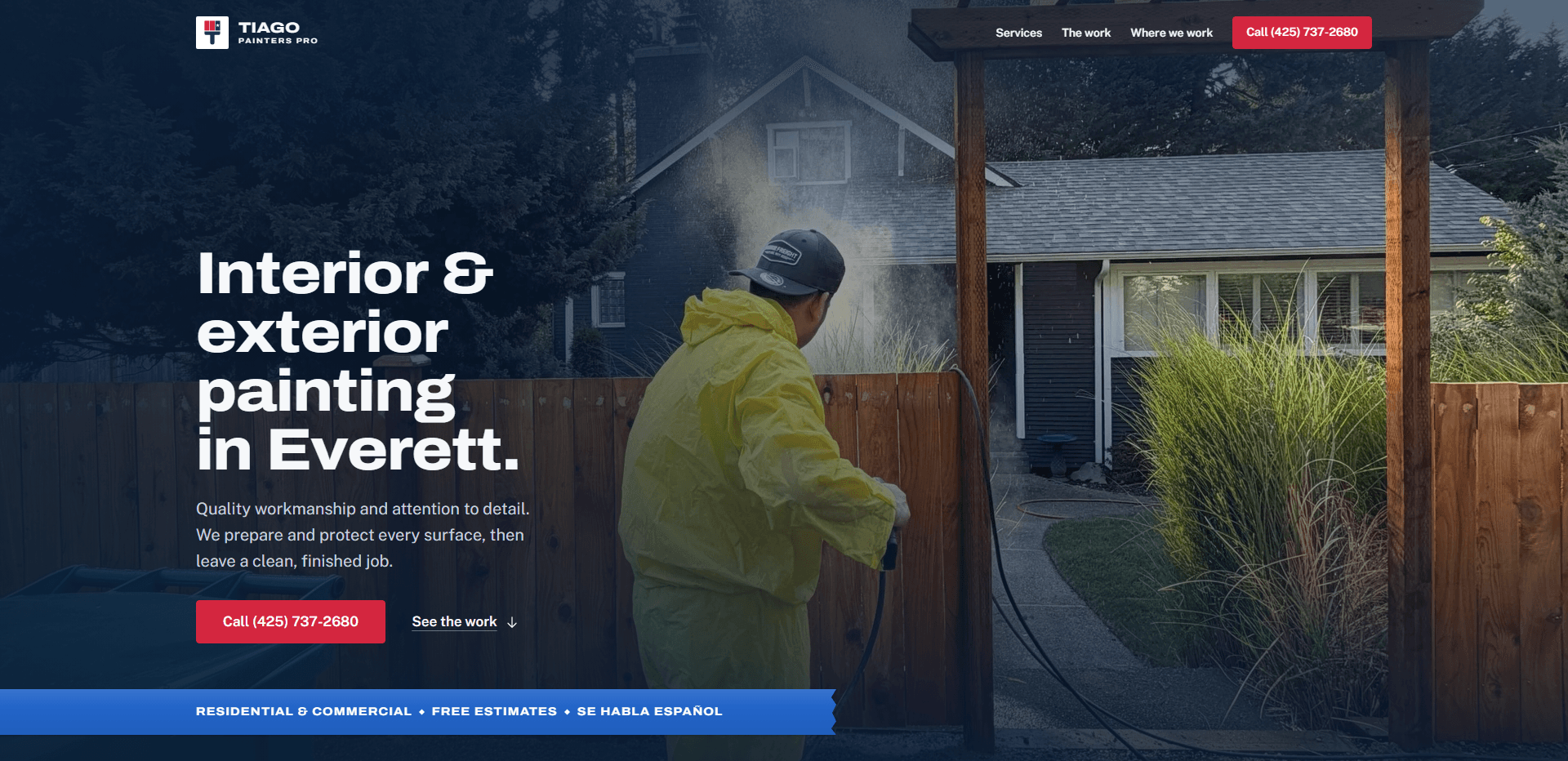 Homepage of Tiago Painters Pro: a deep navy wash over a photograph of a painter in a yellow rain suit and cap spraying a cedar fence beside a wooden arbor in front of a grey house, under a top bar carrying a red, white, and blue 'Tiago Painters Pro' logo, navigation reading Services, The work, and Where we work, and a red phone number button, above the heavy headline 'Interior & exterior painting in Everett.', a paragraph about quality workmanship, preparing and protecting every surface, and leaving a clean, finished job, a red 'Call' button with the phone number beside a 'See the work' link, and a blue band reading Residential & commercial, Free estimates, and Se habla espanol.